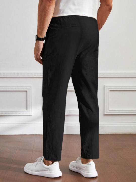 Manfinity Basics Men's Casual Solid Color Weave Tapered Pants