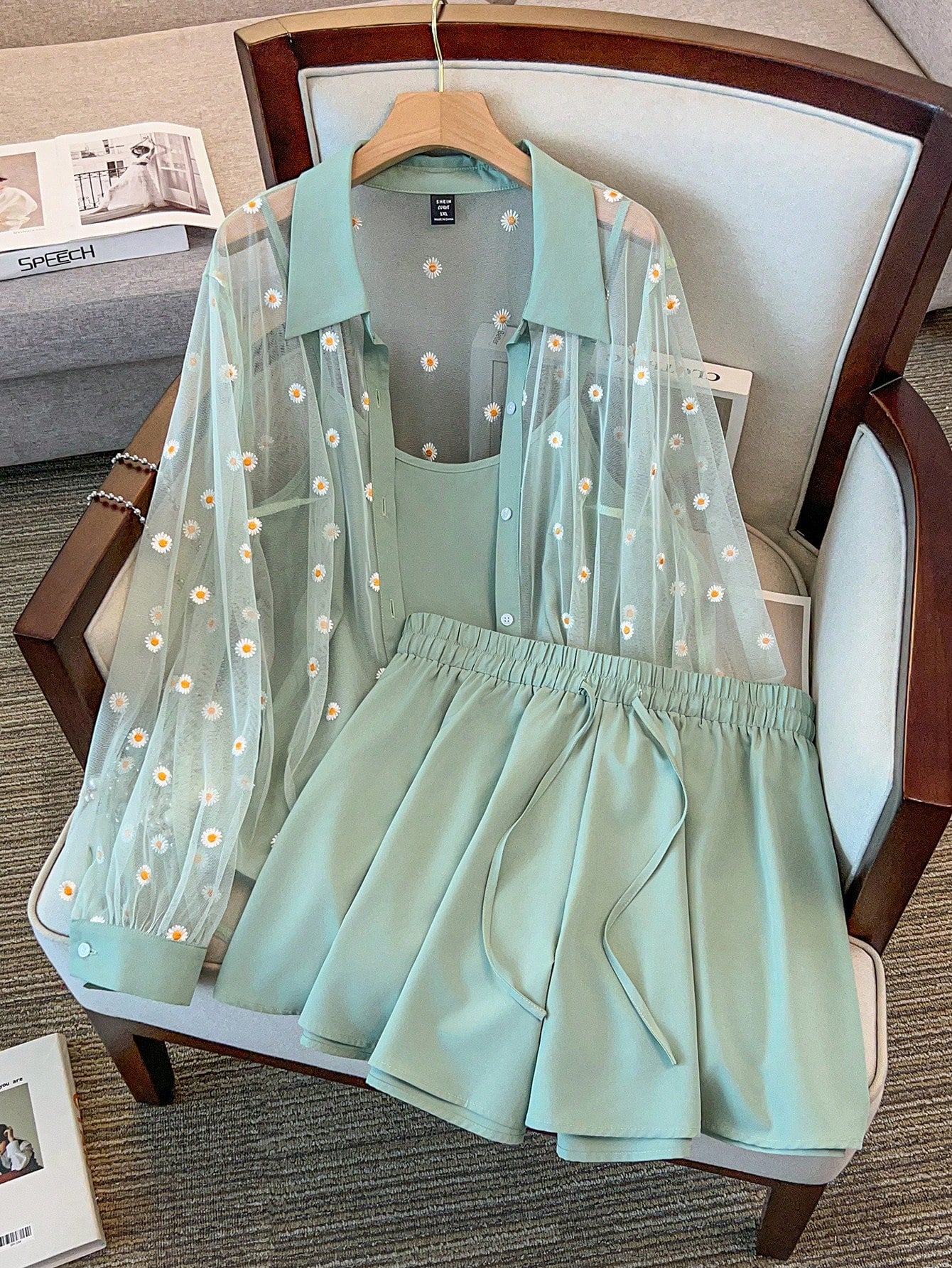 A three-piece outfit set for women, featuring a net embroidery crochet vest, camisole, and shorts, displayed on a mannequin.