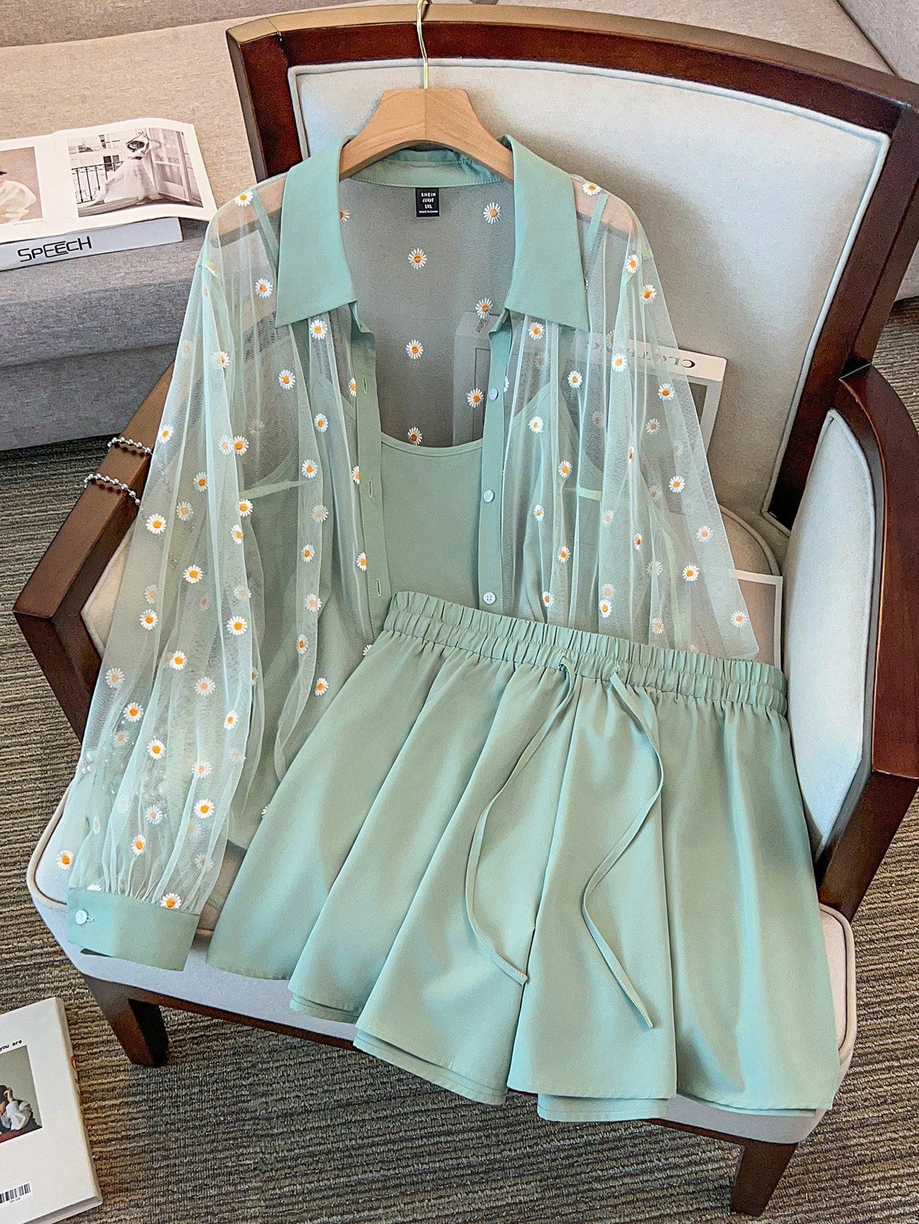 A three-piece outfit set for women, featuring a net embroidery crochet vest, camisole, and shorts, displayed on a mannequin.