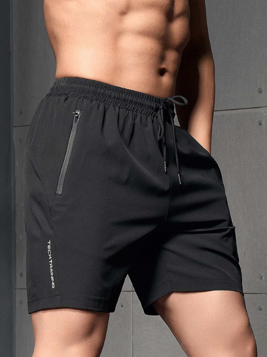 Sport Corelite Men Letter Graphic Zipper Pocket Sports Shorts