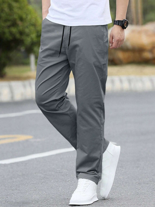 Manfinity Homme Loose Fitting Solid Straight Leg Men's Pants