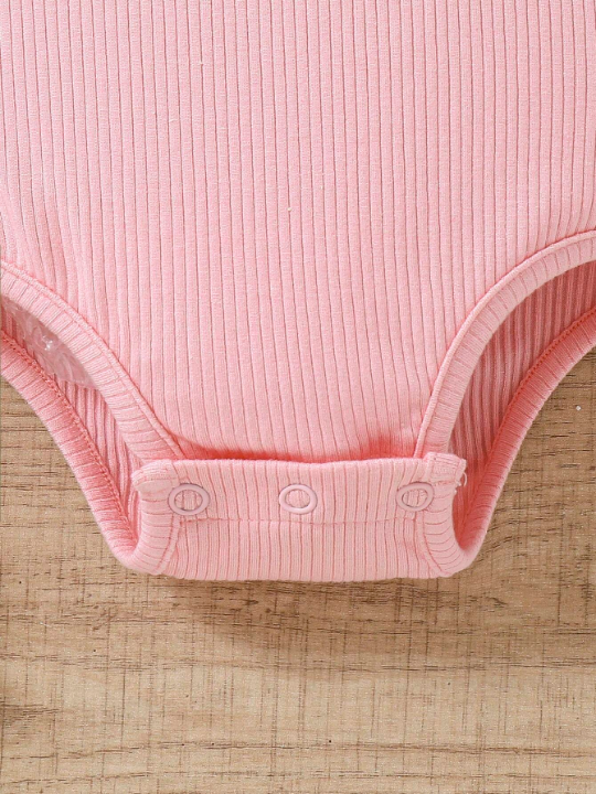 Baby Girl Pink Knitted Bodysuit With Heart Detail & Mesh Panel At Bottom